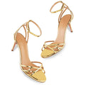 Gold strappy heels