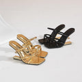 Strappy gold and black heels